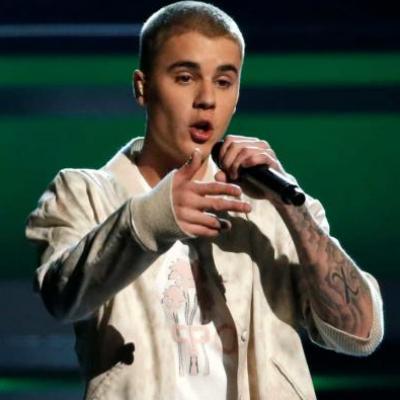 Bieber é processado por paparazzo após postar foto sem autorização